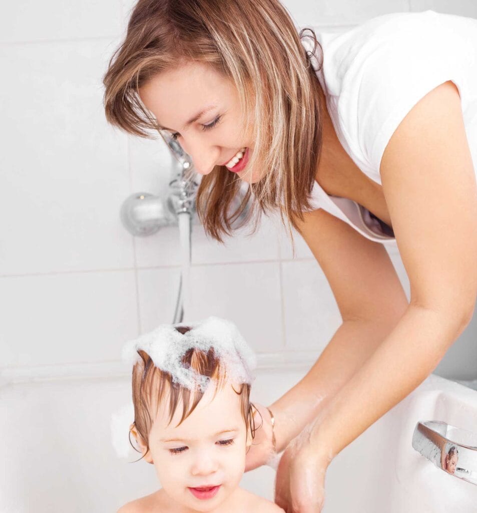 Mother bathes the baby with clean water