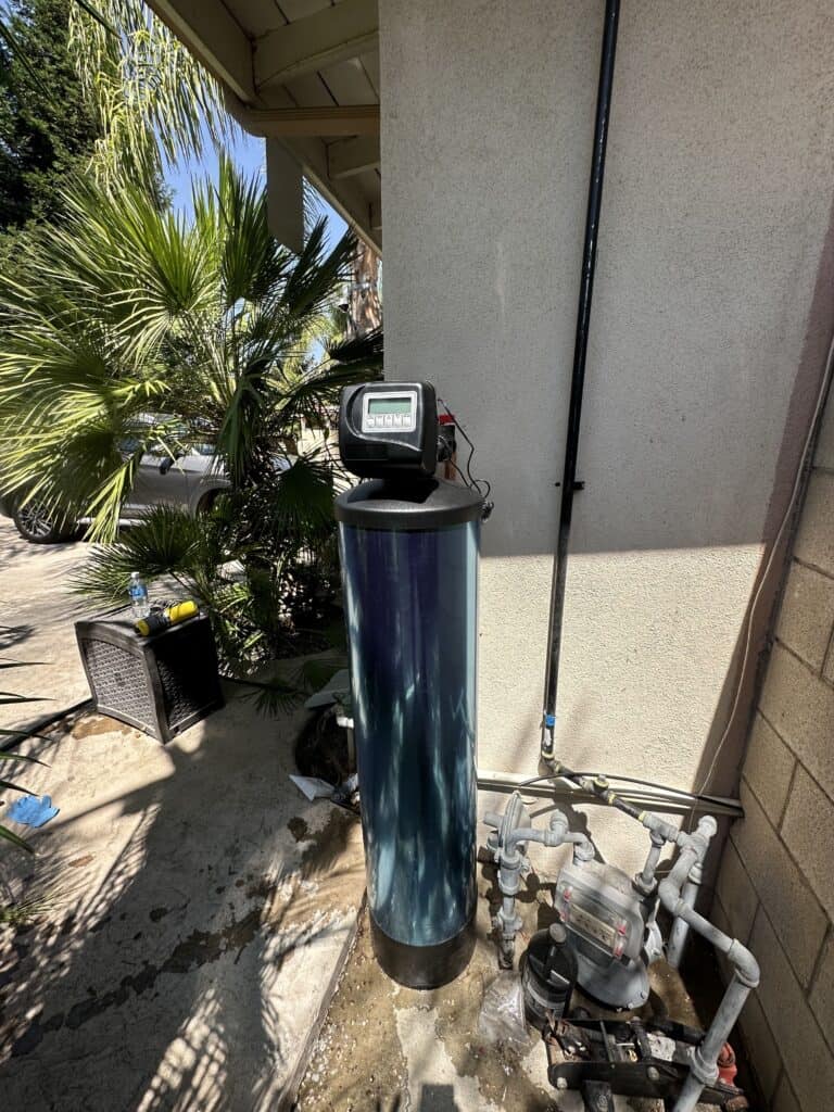 praz signature softener blue tank connected to the main water line at a home