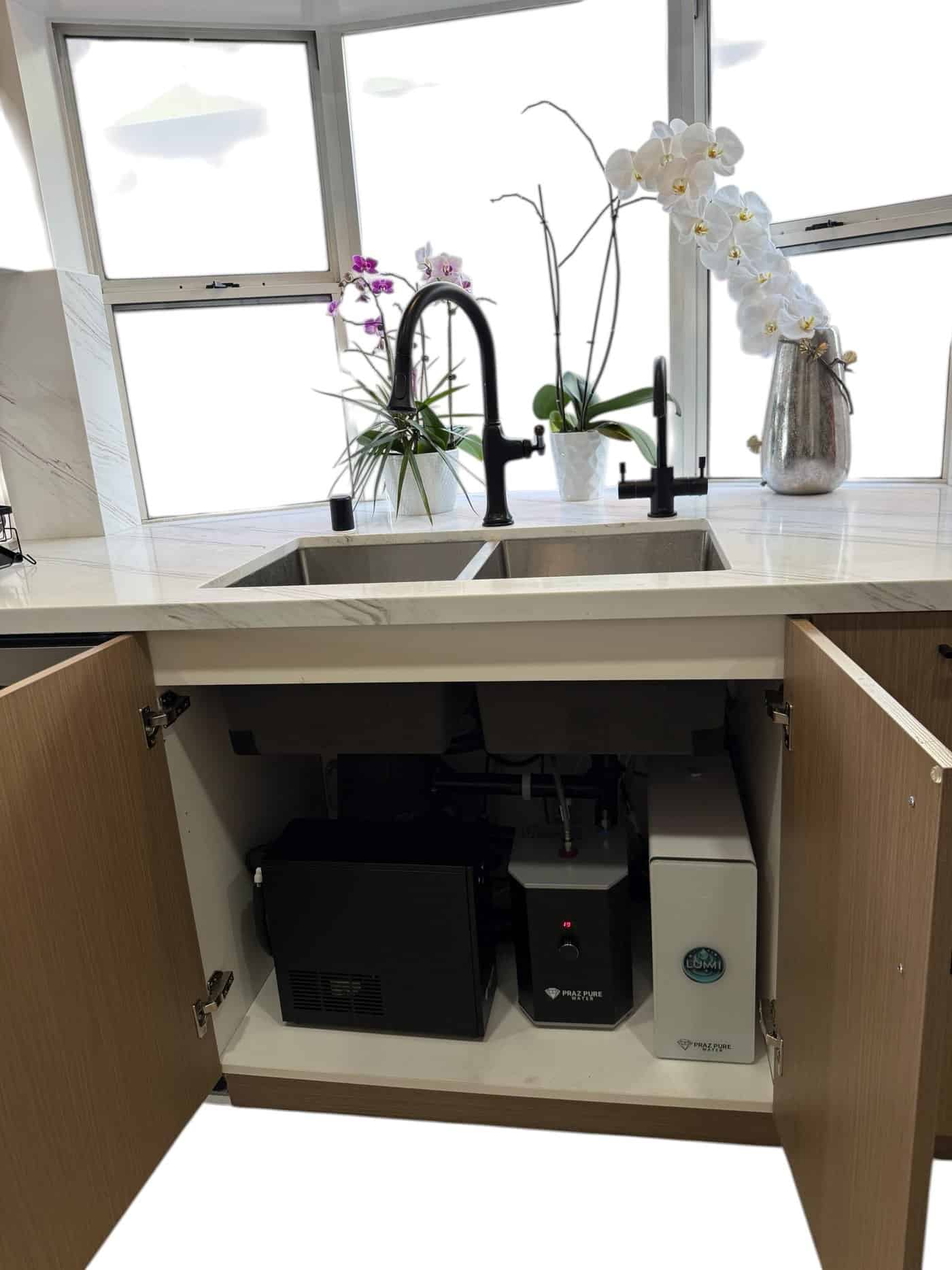 Reverse osmosis system, instant hot water tank and water chiller installed under a kitchen sink